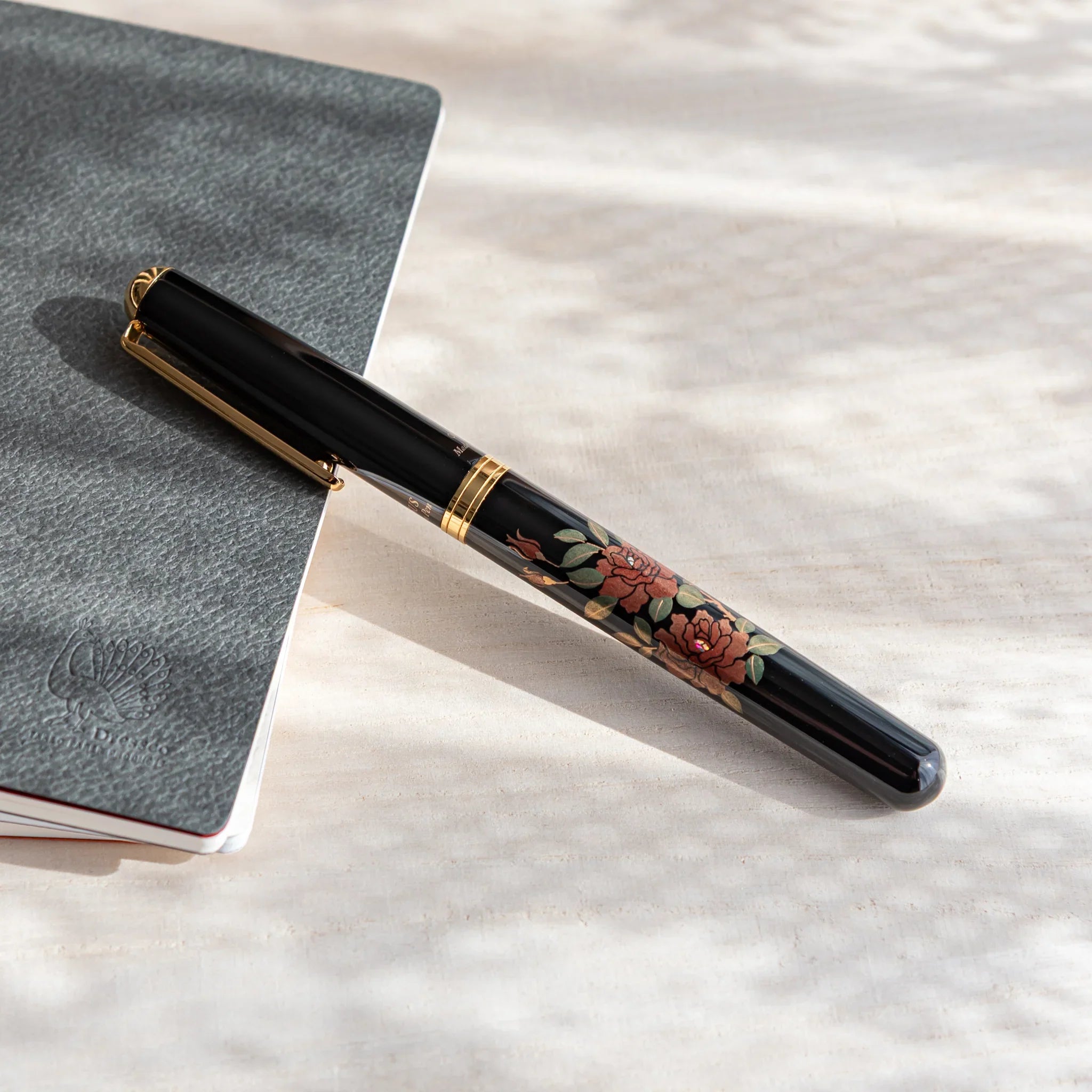Rose Yamanaka fountain pen with lacquer design shown in composition shown in composition product composition view