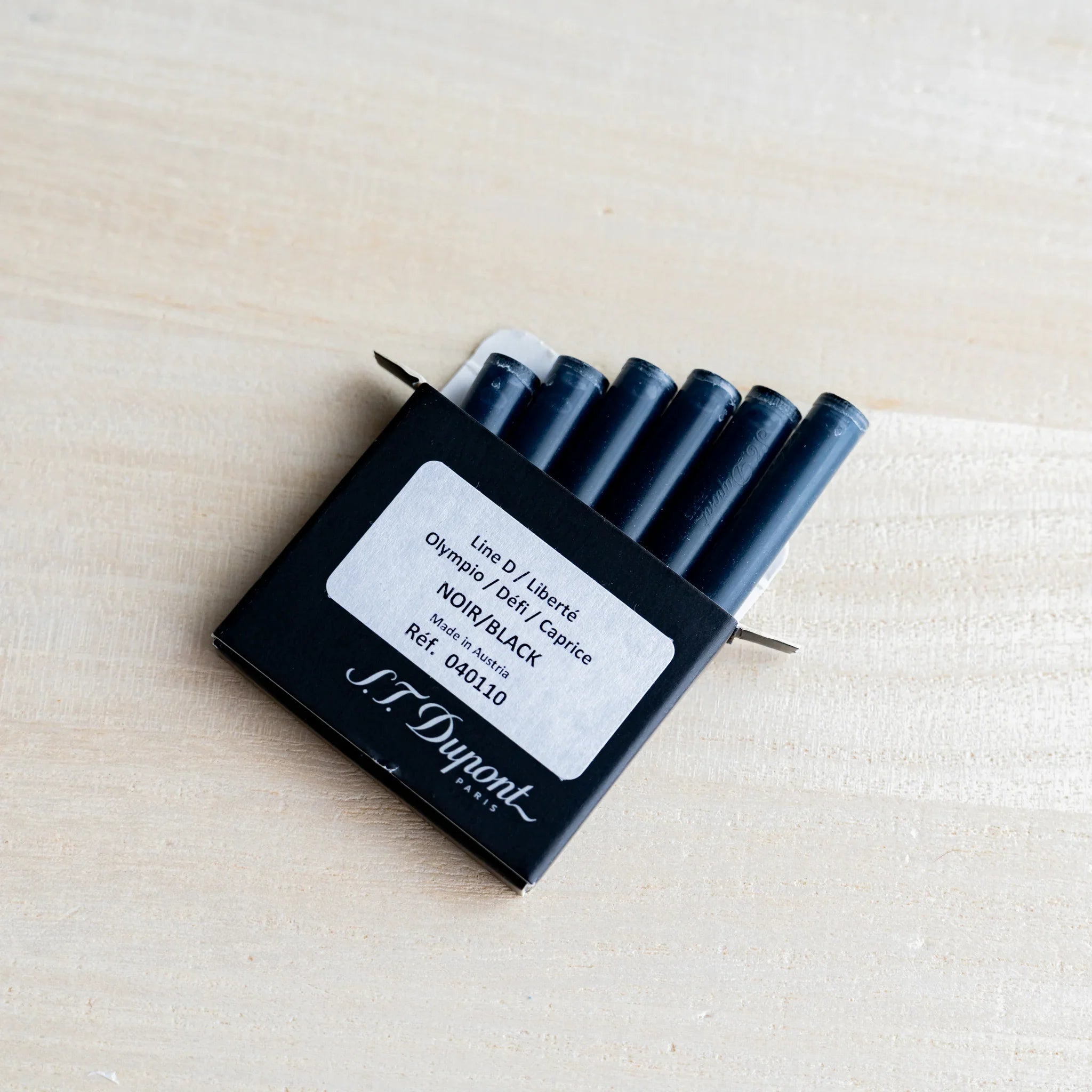 Open S.T. Dupont box showing six black fountain pen ink cartridges, label reads Line D black, Made in Austria
