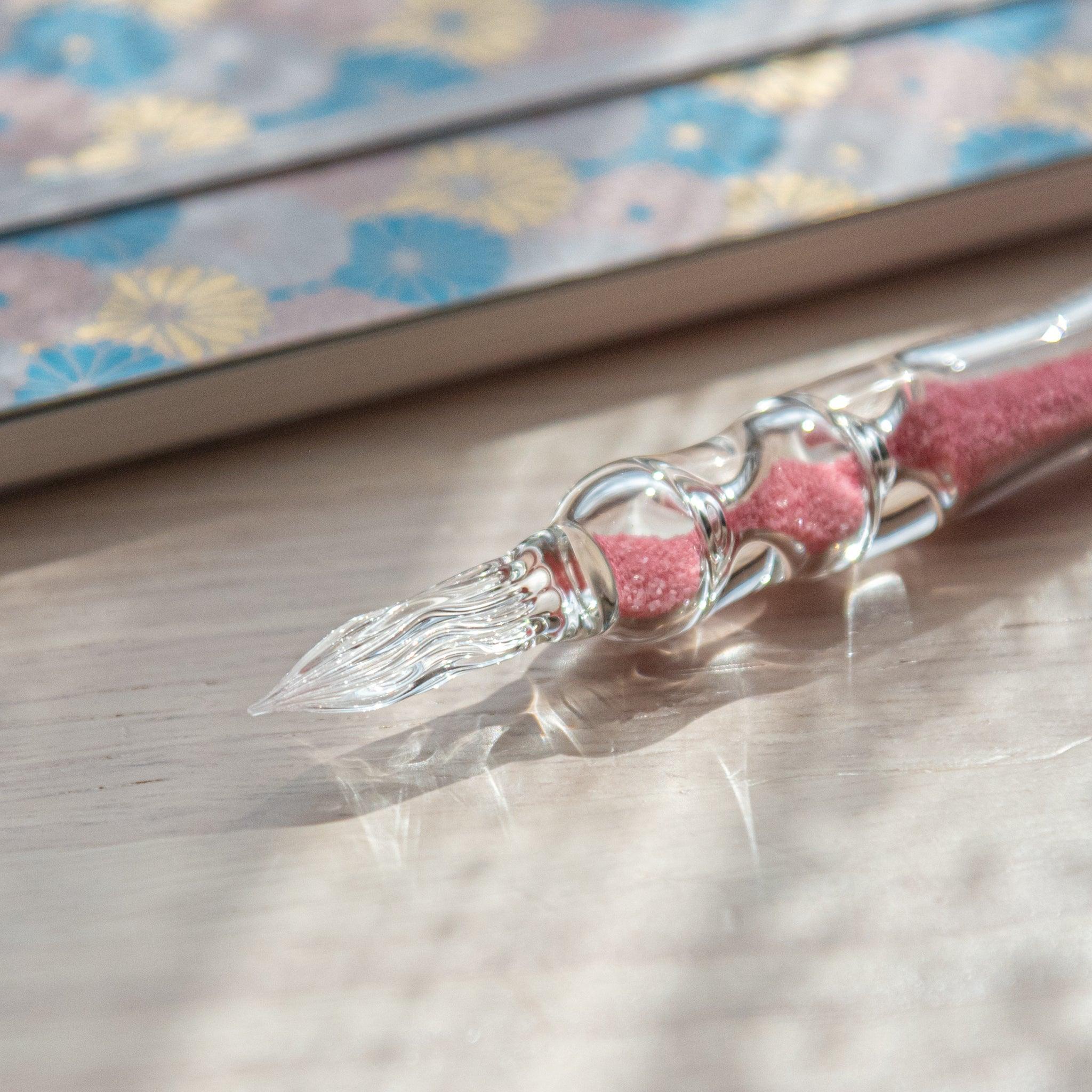 Sakura Hourglass Glass Dip Pen side angle showing pink cherry blossom design around hourglass-shaped transparent glass