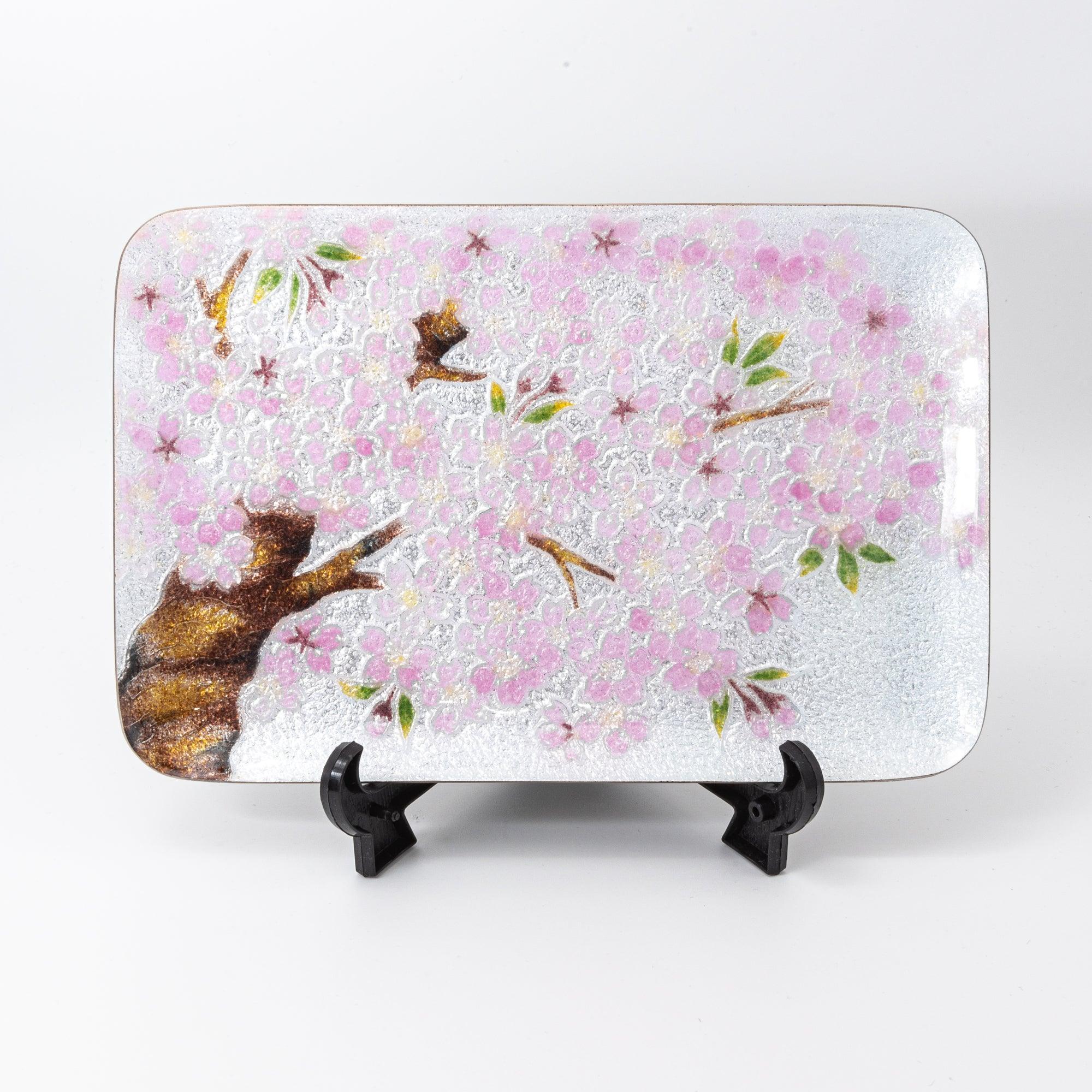 Sakura shippo ware silver pen tray on black display stand, front view showing pink sakura blossom and tree design