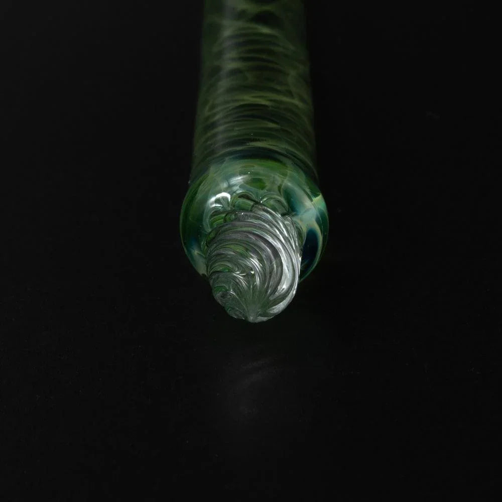 Macro shot of silver nib tip with muted green glass surround viewed from below in Smoke in Verdure pen