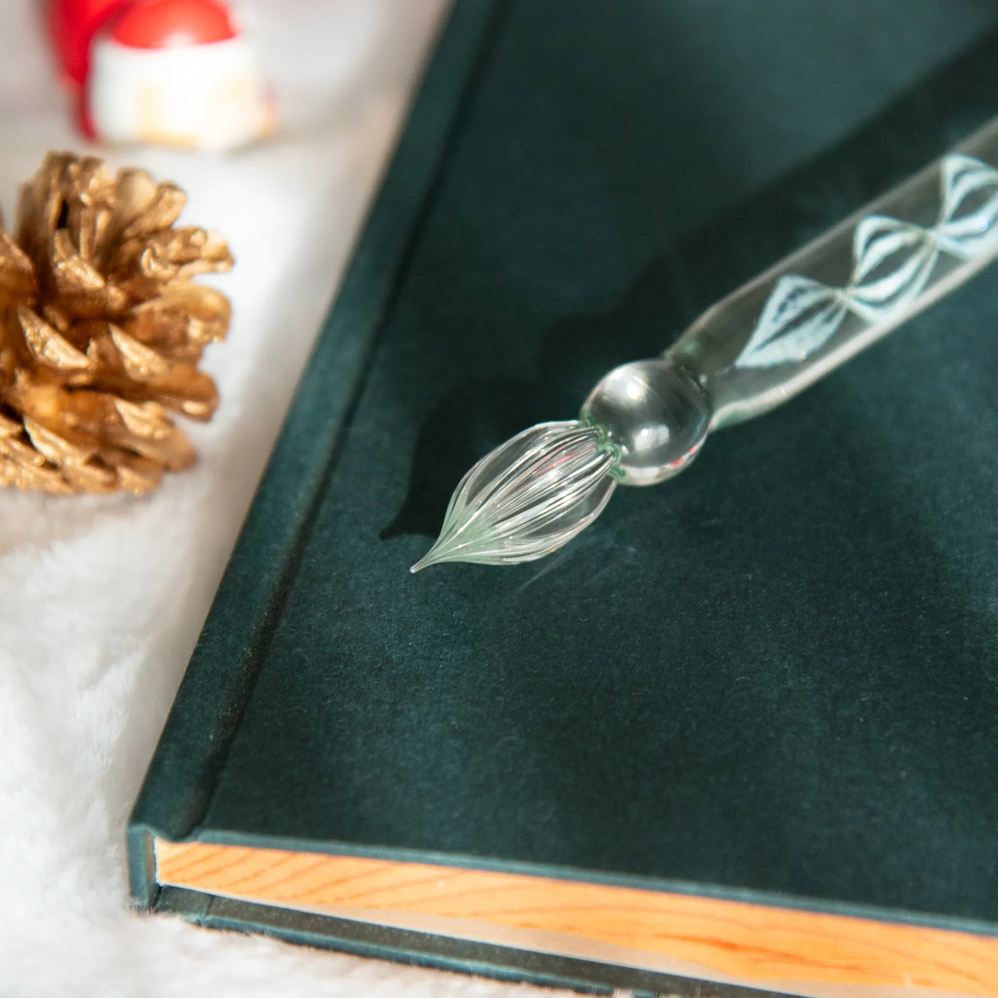 Snow Globe glass dip pen showing shimmering white snow effect in transparent glass barrel detail view with holder