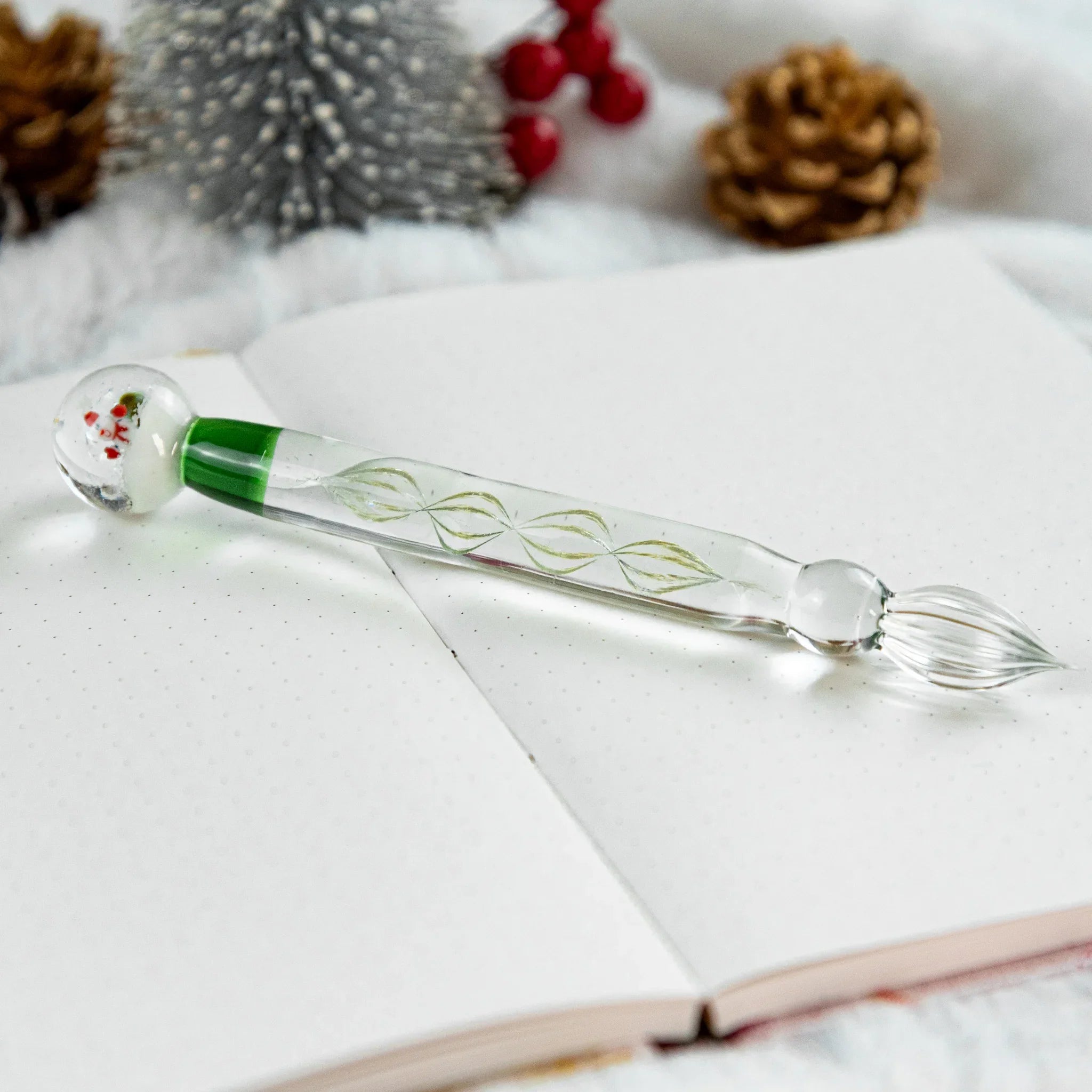 Snow Globe glass dip pen featuring magical white sparkle snow effect in transparent glass barrel design with holder