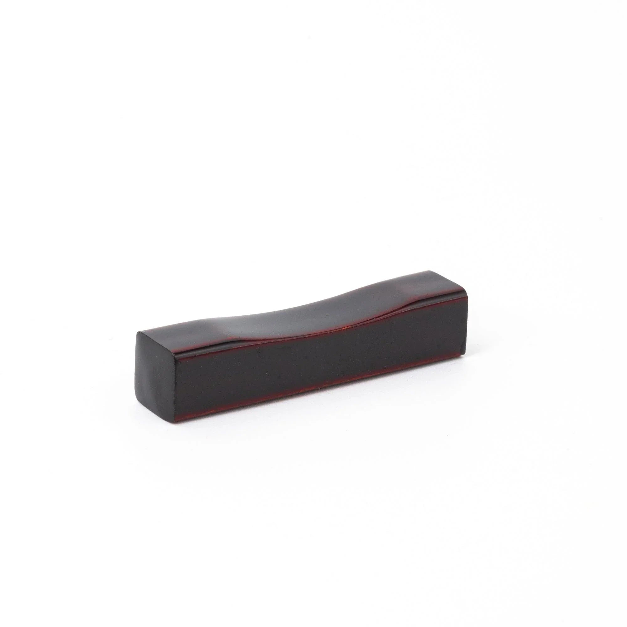 Echizen Tame-Nuri black lacquered sakura wood pen rest features hand-rubbed patina, keeping pens secure during work