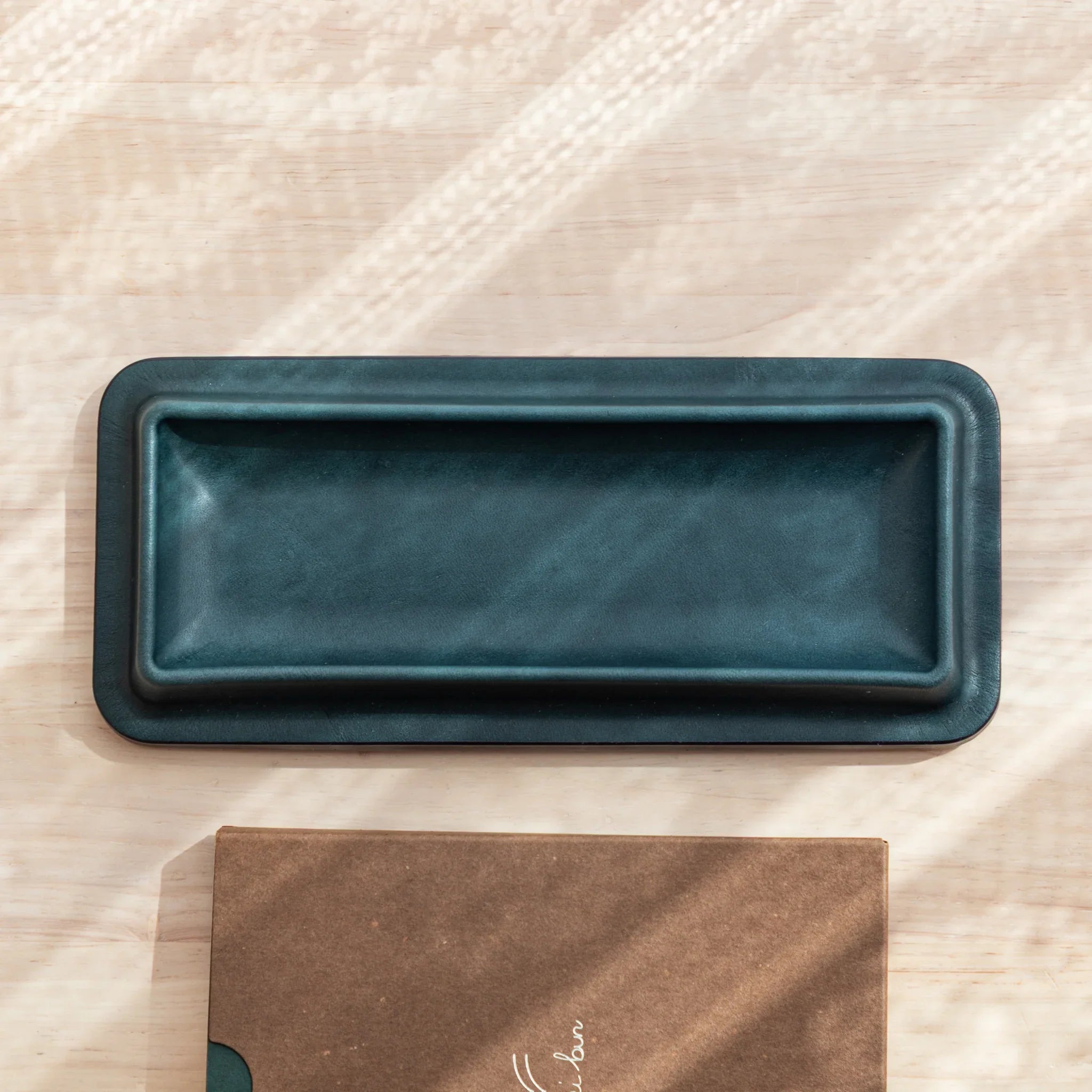 Olive green leather pen tray side profile with red burgundy maki-e pen holder display shown very clearly