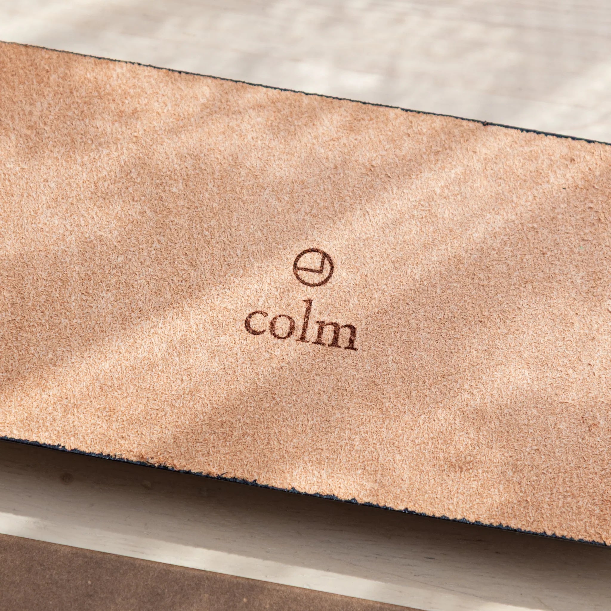 Olive green suede corner detail showing snap hardware and texture finish of the tray base and side edge