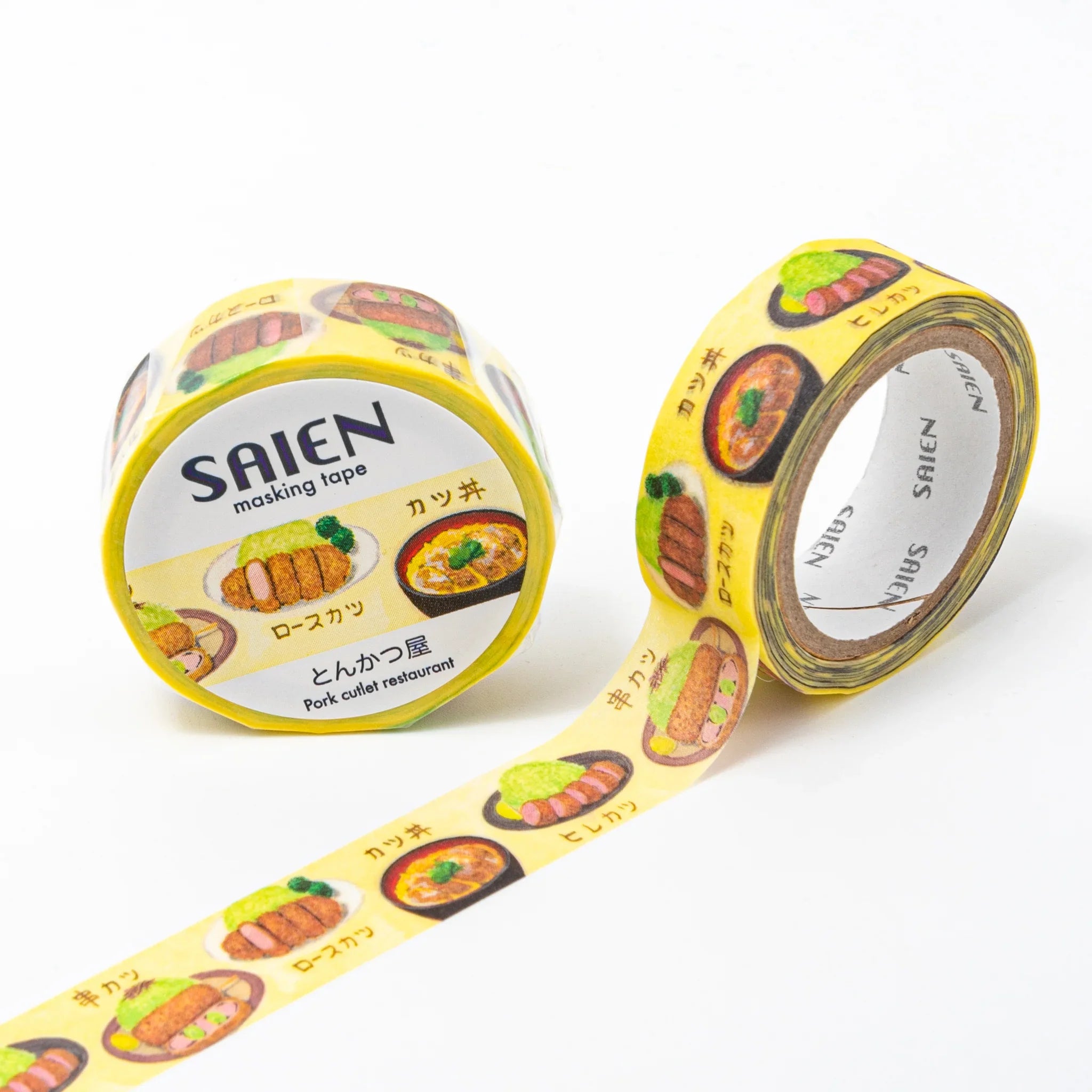 Yellow tonkatsu Iyo washi tape roll with golden fried pork cutlets and sauce bowl decorative designs partially unrolled