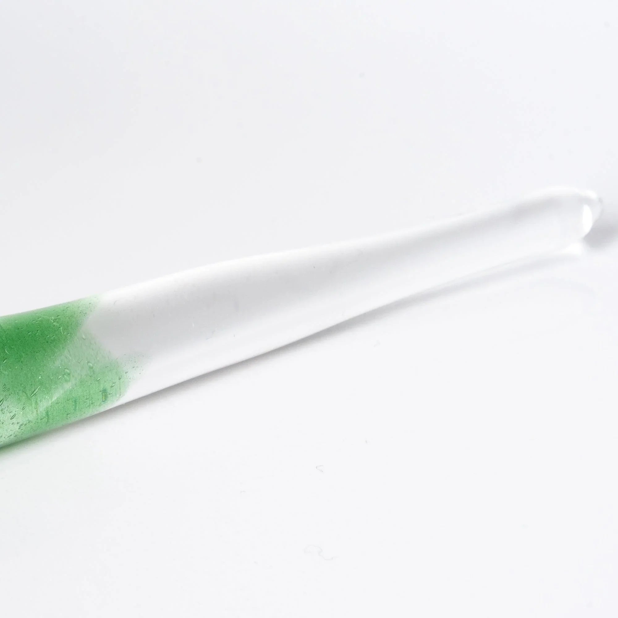 Tsukuyomi green glass dip pen captured in soft light displaying ethereal green translucent barrel and silver nib