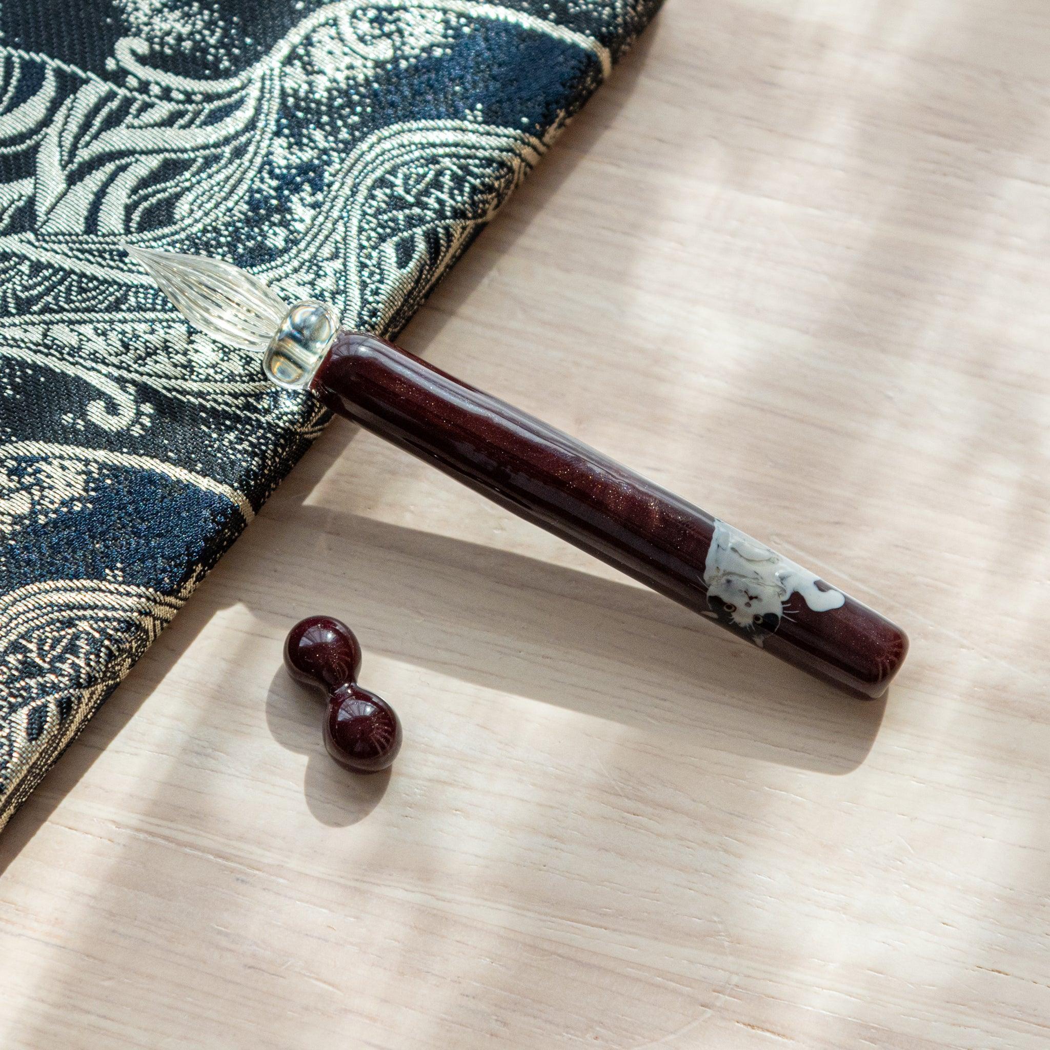 Tuxedo Cat Glass Dip Pen with Pen Rest detail showing glass barrel with black and white feline pattern and ink cartridge