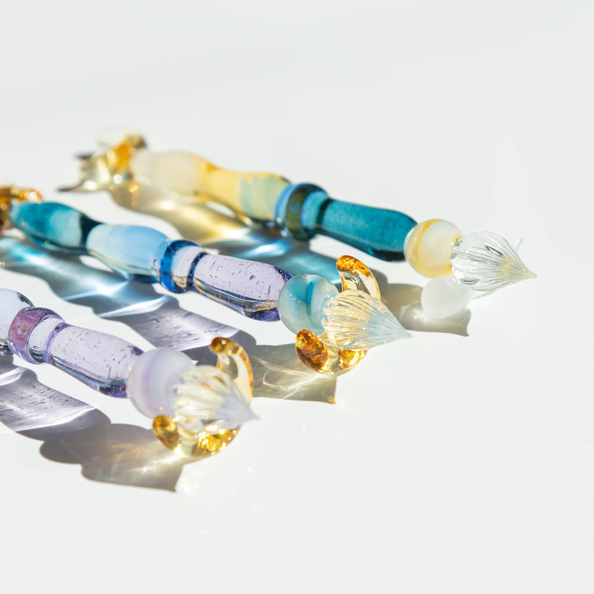 Twilight Star glass dip pen complete composition displaying purple striped barrel, white brush, and gold star rest