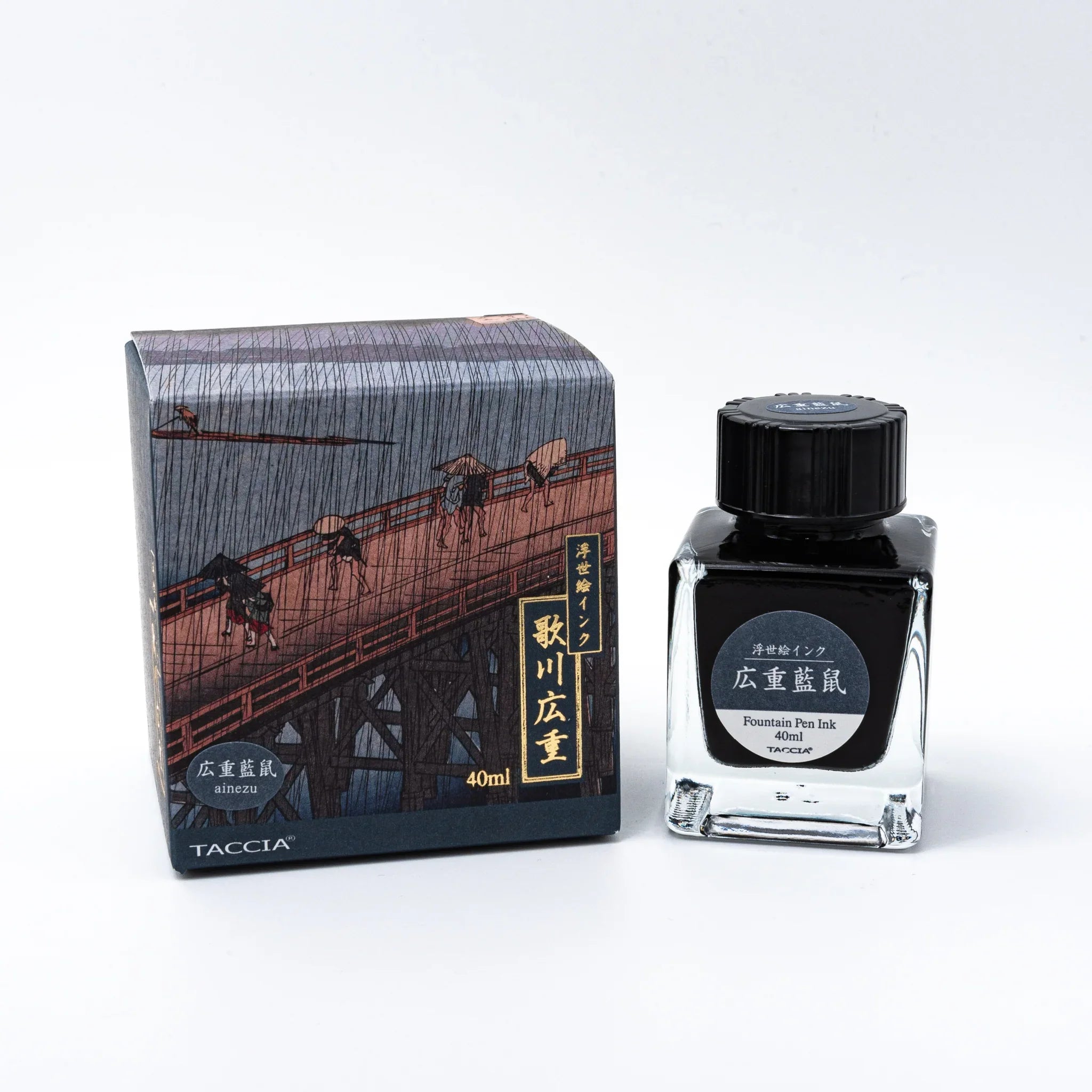 TACCIA Hiroshige-ainezu indigo-grey fountain pen ink box and bottle grouped together on white background surface