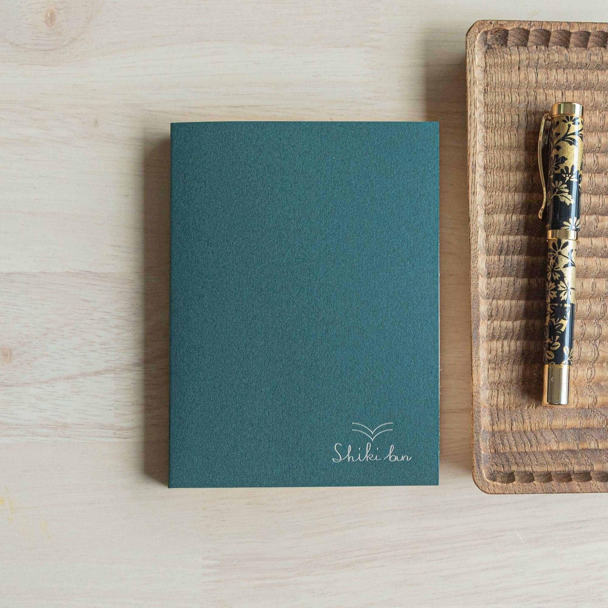 Red Pine wood-paged A6 journal, spine showing traditional Japanese construction and natural wood grain
