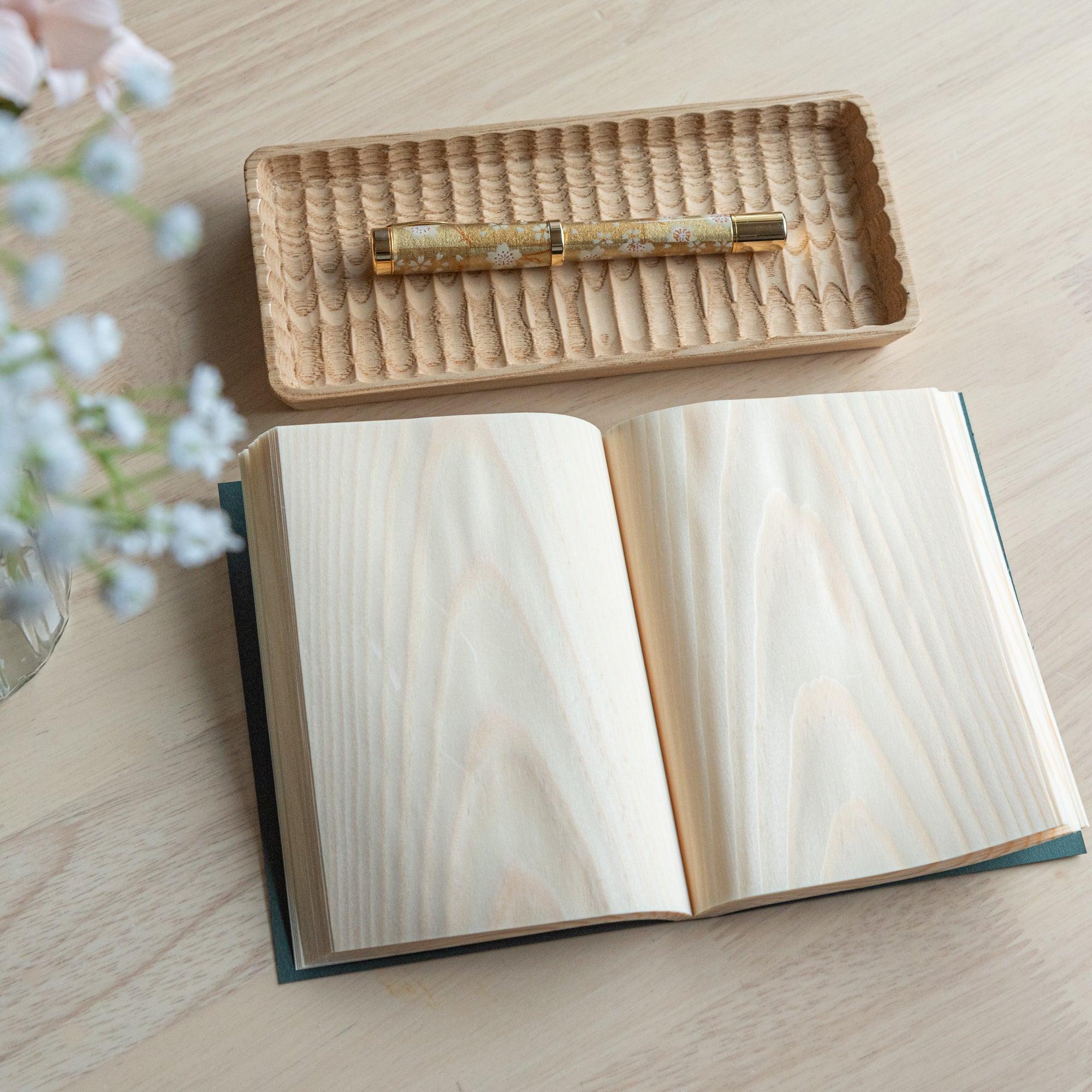 Red Pine wooden page A6 notebook, natural wood grain front cover detail showing wood texture and binding