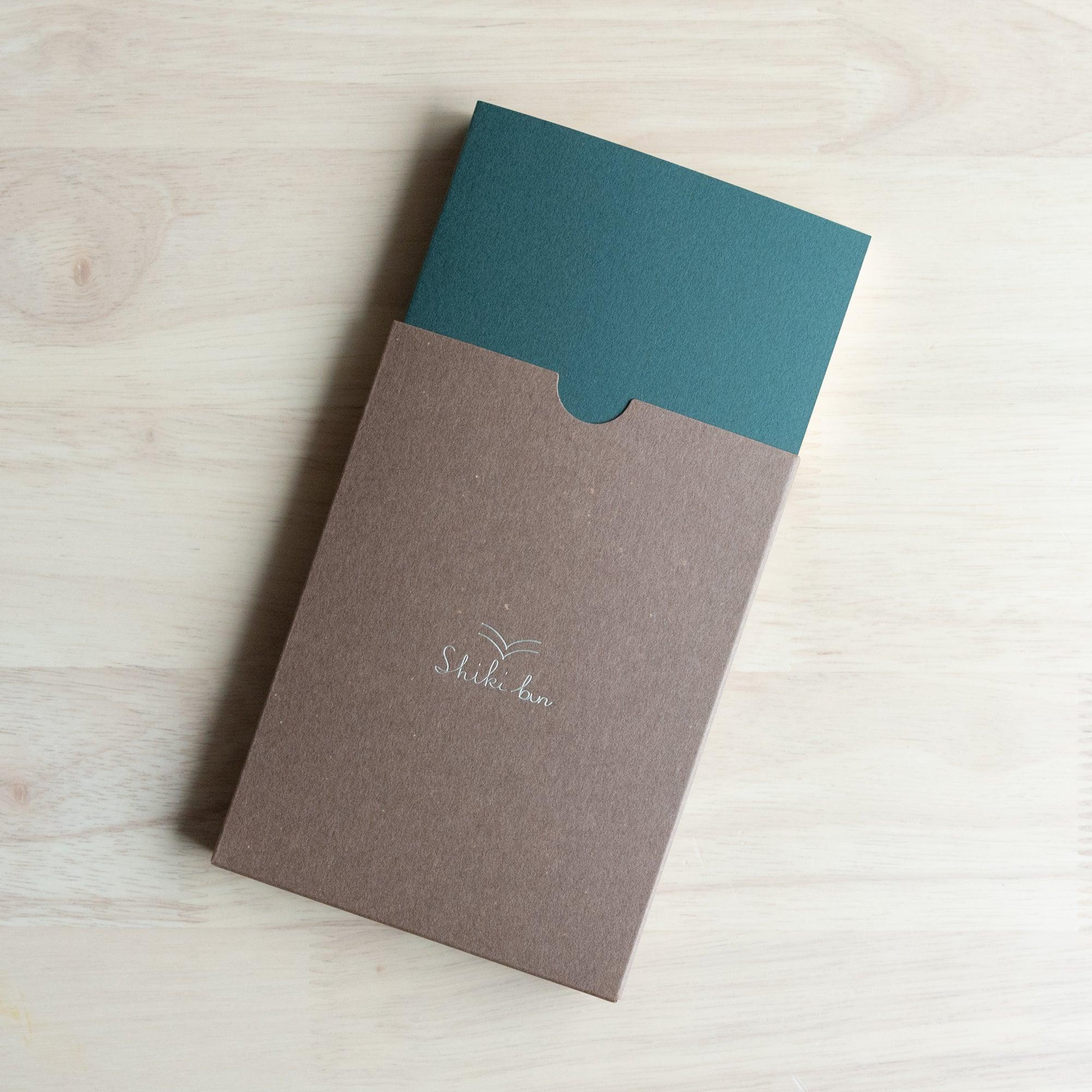 Japanese red pine wooden A6 journal, angled product with natural wood texture and binding craftsmanship