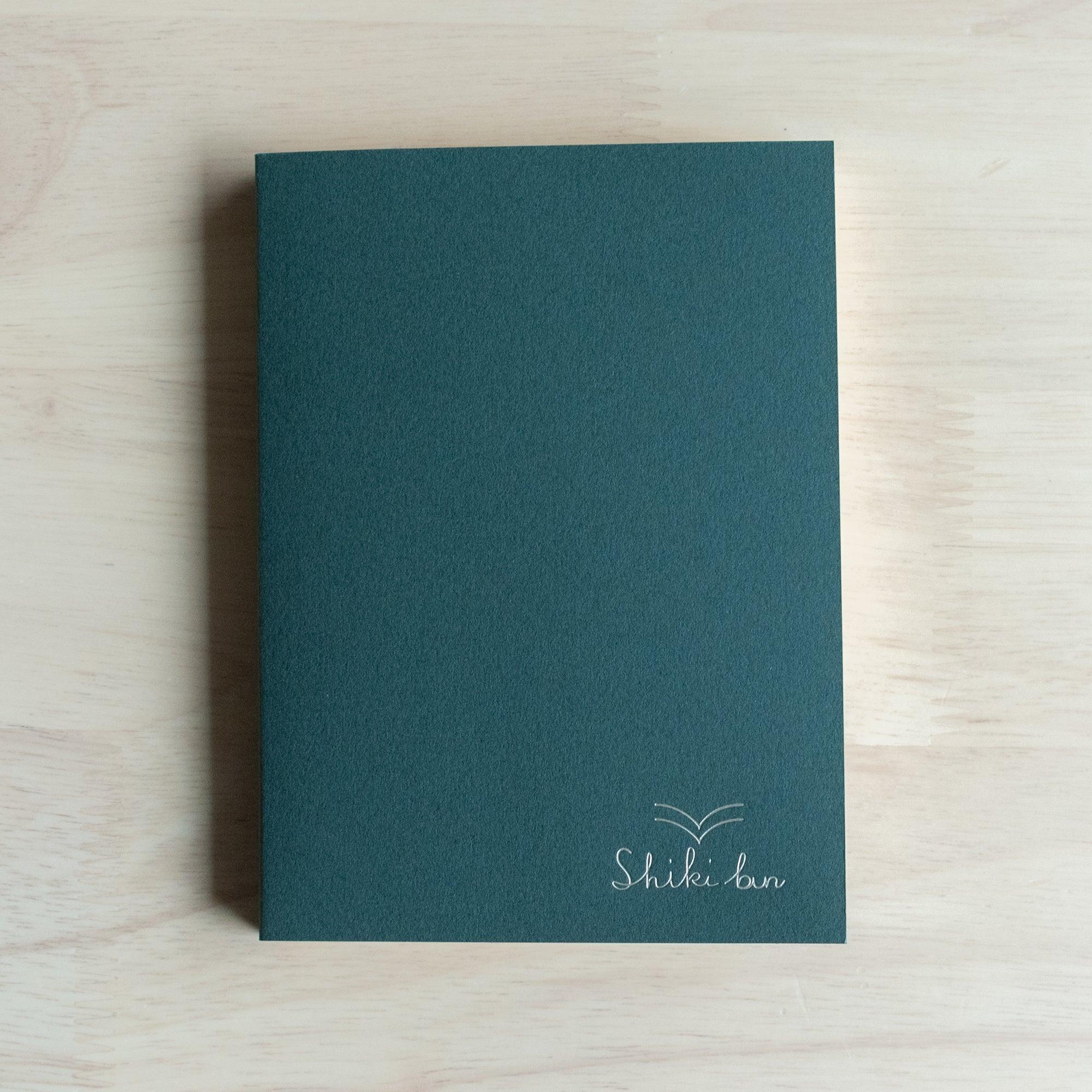 Red Pine wooden page A6 notebook, flat lay of closed journal emphasizing natural grain pattern detail
