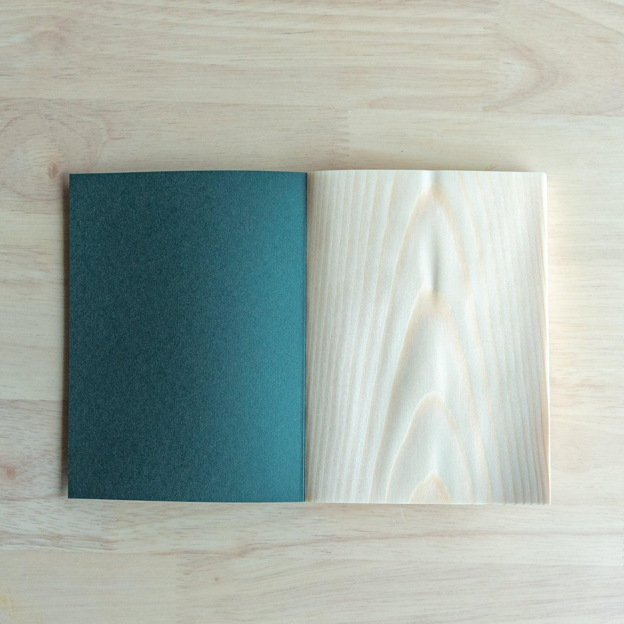 Wooden page red pine A6 notebook, corner detail showcasing natural wood craftsmanship and binding showing natural wood