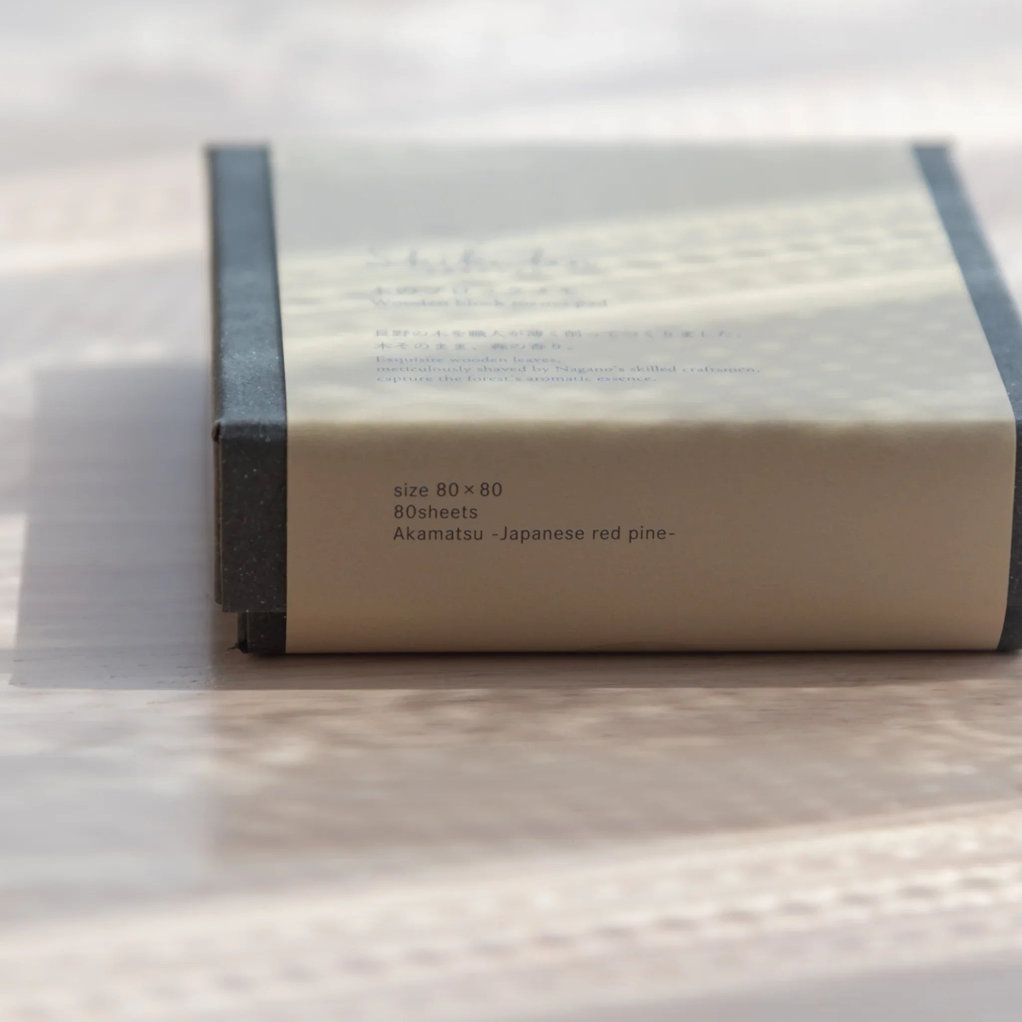 Side of Shikibn wooden sheet memo pad box showing size 80x80mm, 80 sheets, and Akamatsu Japanese red pine material