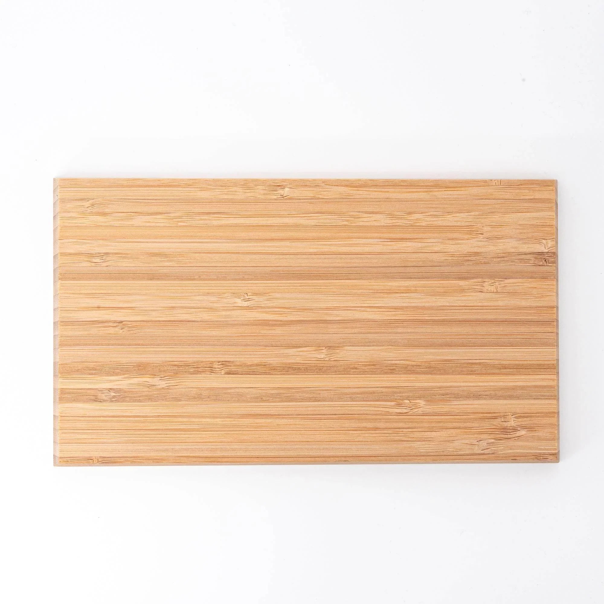Natural bamboo rectangular pen storage tray with scattered gold leaf inlay, photographed directly from above