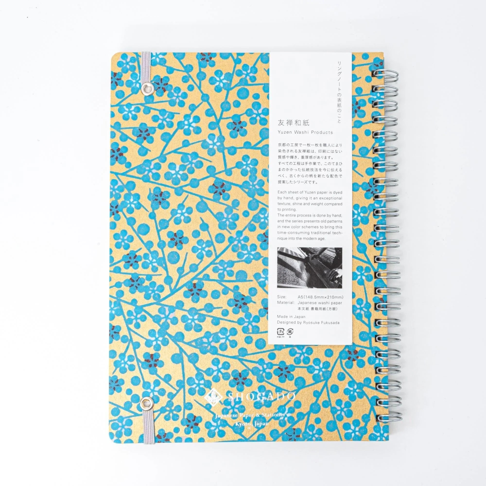 Detailed view of hand-dyed Yuzen washi spiral notebook binding showing quality construction and cover