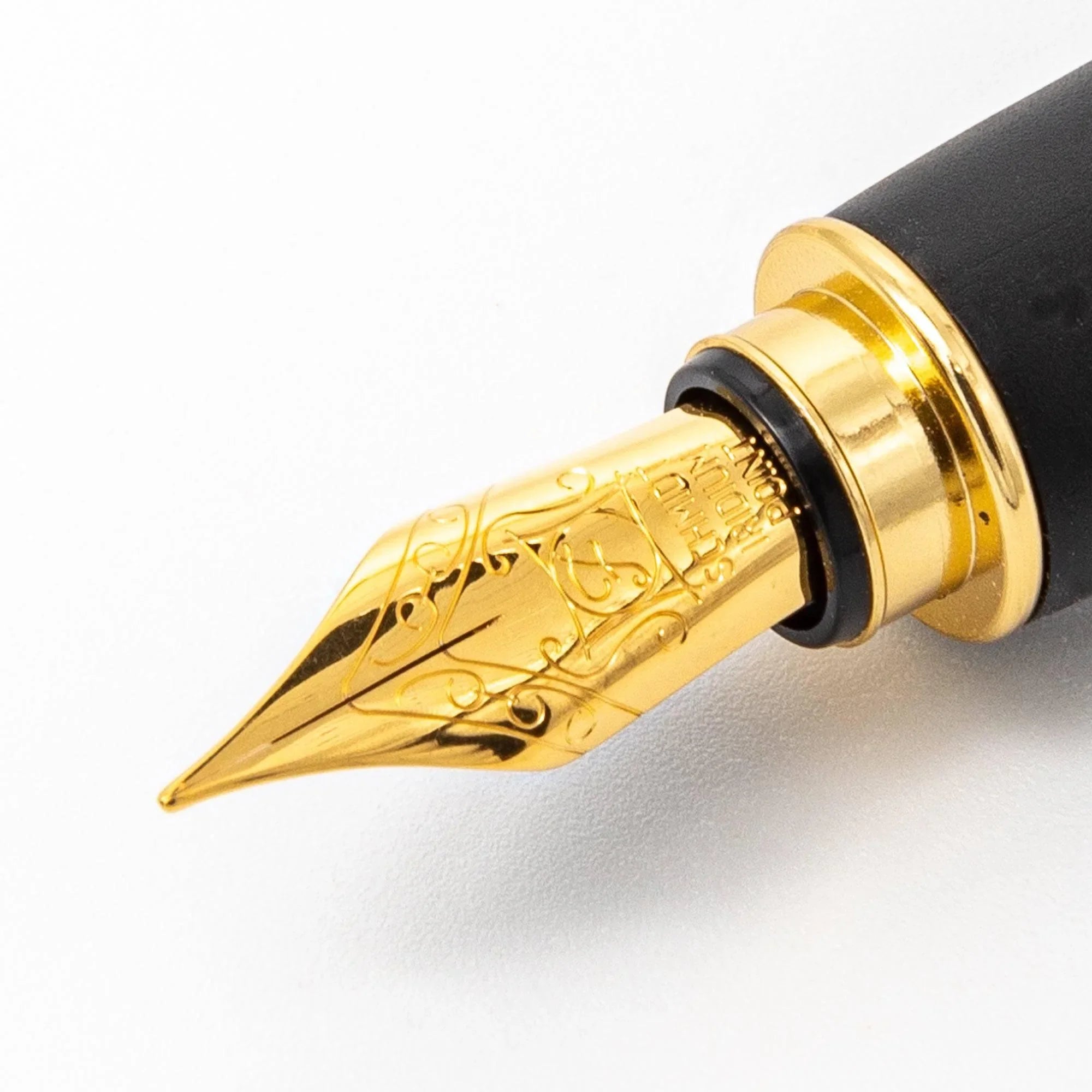 Wine red fountain pen close-up detail of fine gold crackle finish on deep burgundy lacquer surface design