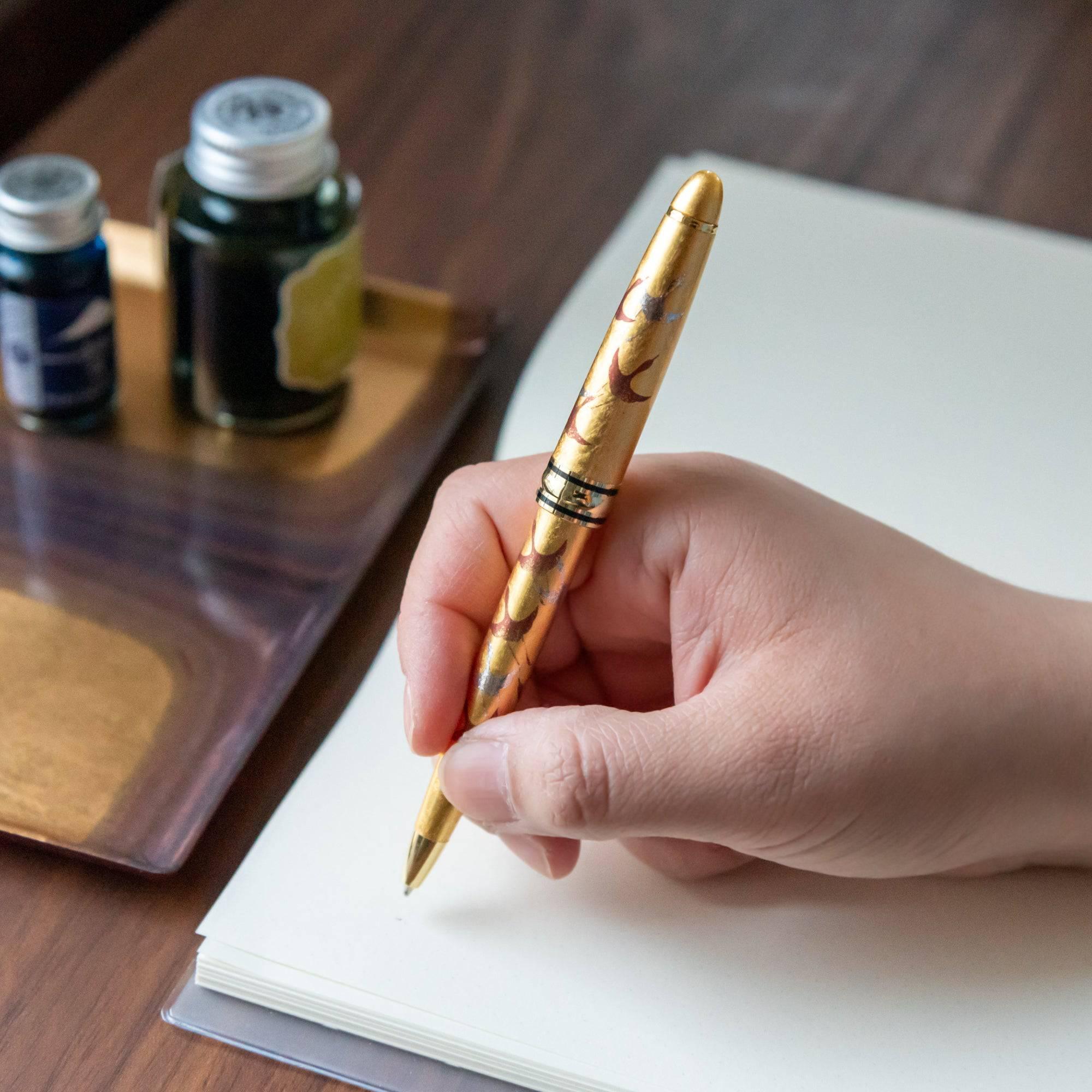 Capped Gold Leaf Crane Makie ballpoint pen in gold showing detailed traditional crane bird motif design