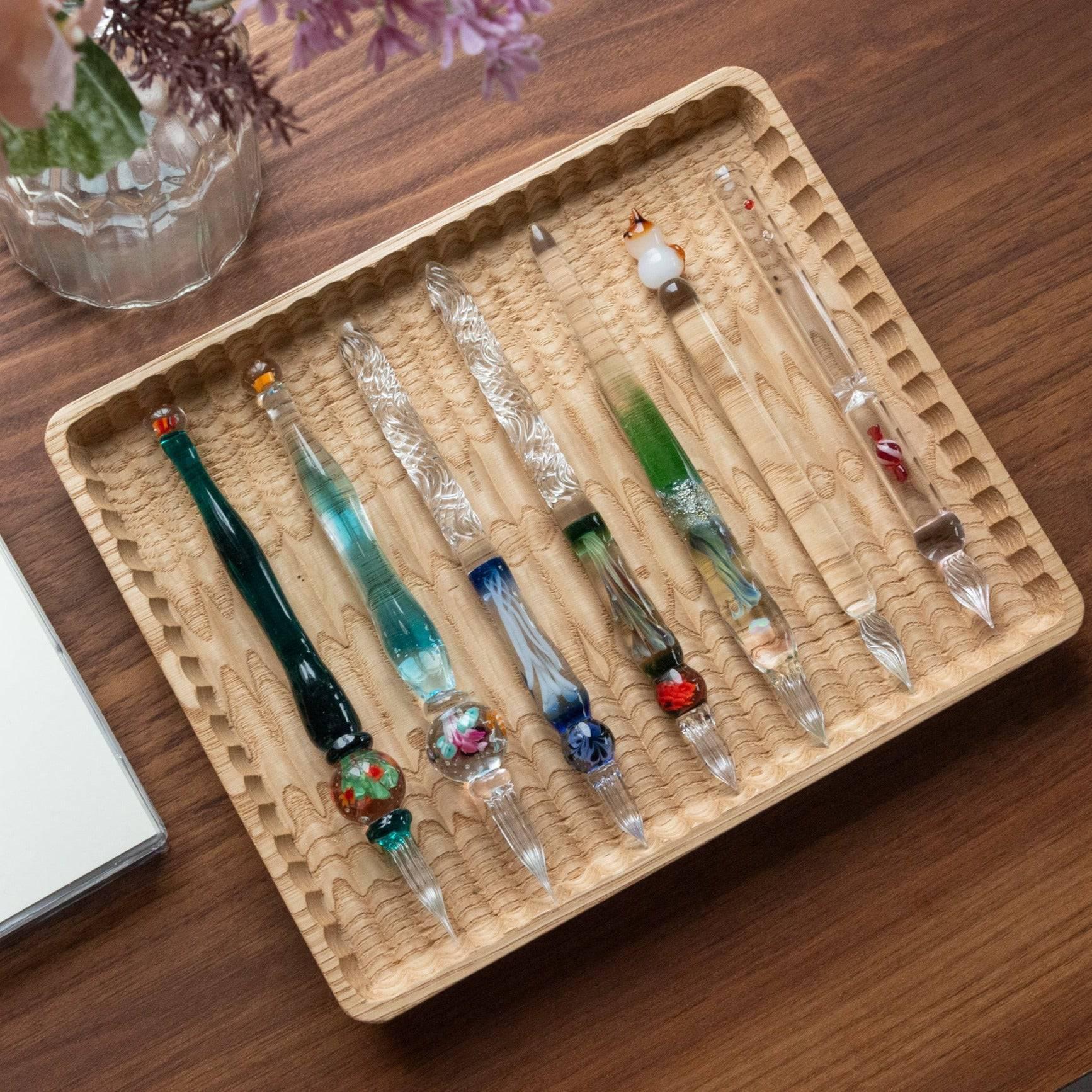 Chestnut wood pen tray showing natural light wood finish with prominent carved ridge pattern with clear visibility of design