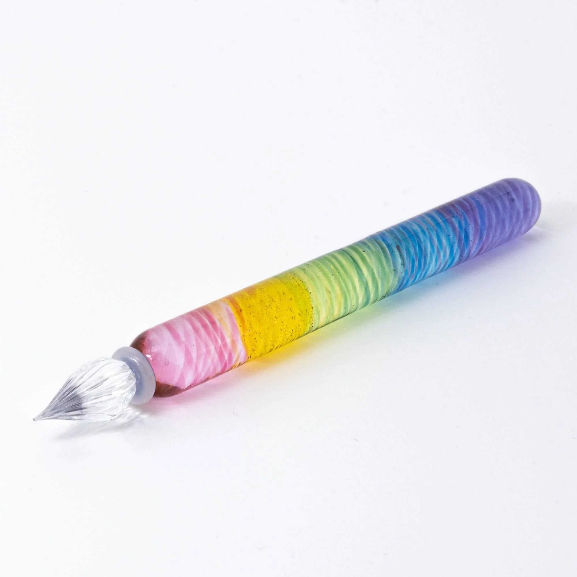 Rainbow striped Japanese glass dip pen with gradient color handle and silver ferrule nib on white background