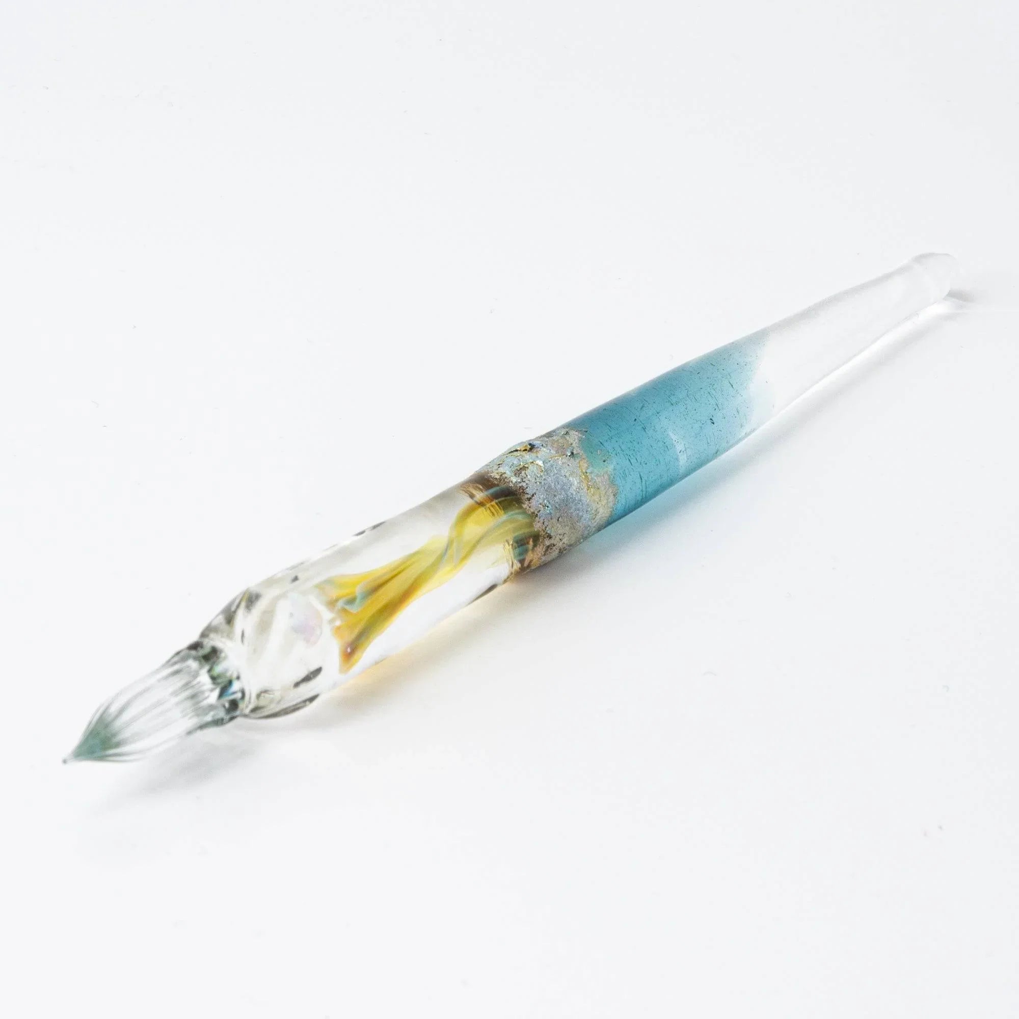 Light blue Tsukuyomi glass dip pen photographed with distinct twisted nib and moon goddess-inspired design shine