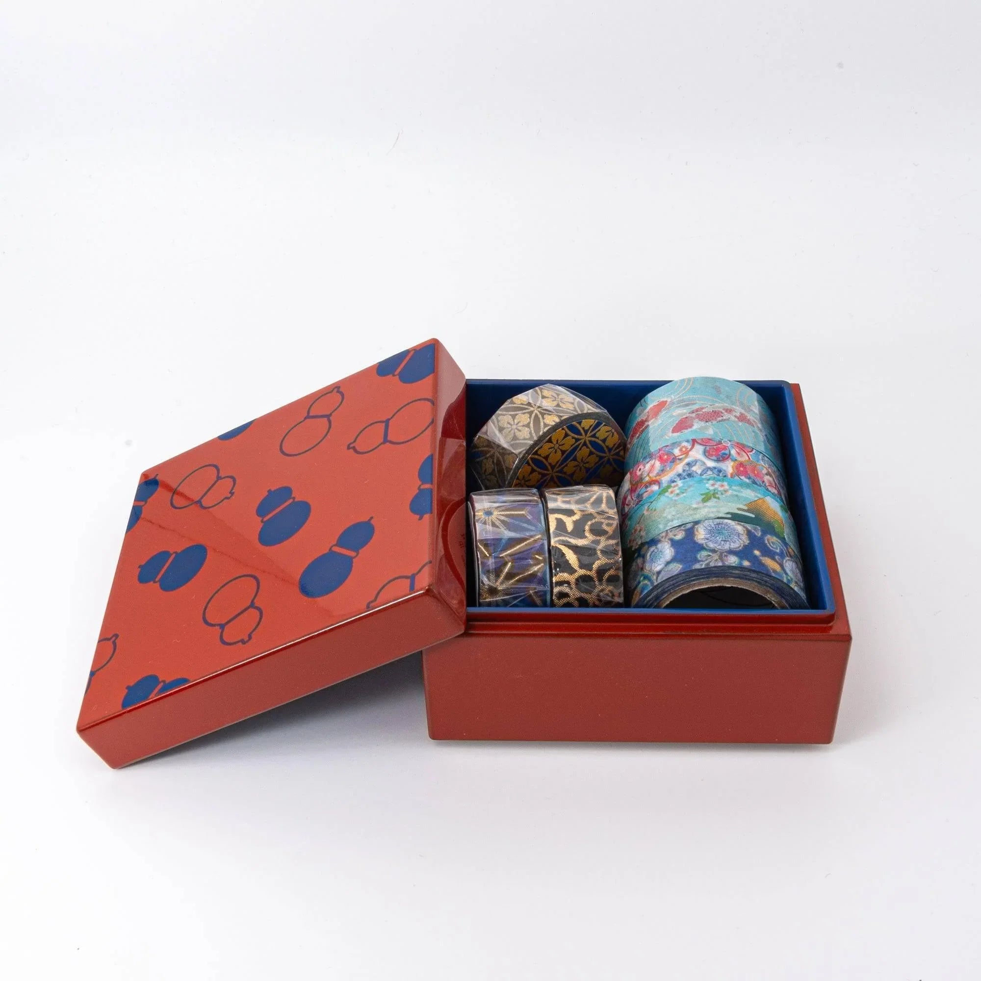 Japanese urushi kohako gourd lacquer trinket box closed in russet-red lacquer with navy blue gourd shape pattern