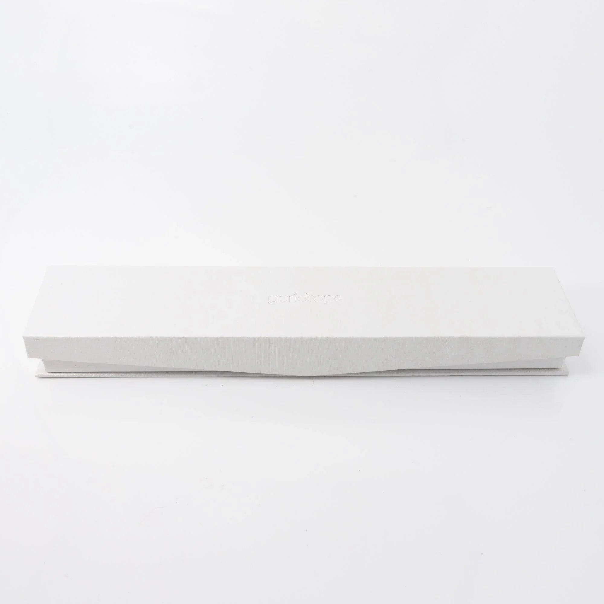 White gift box with Komorebi Stationery branding and Wagashi Monaka glass dip pen shown side angle view